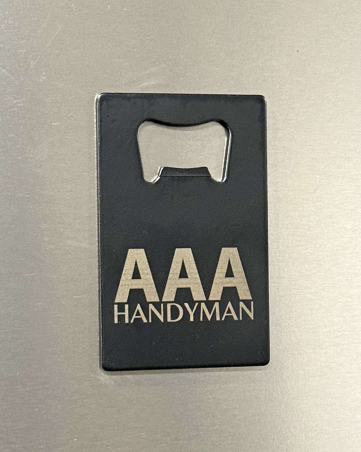 Custom Logo Credit Card Bottle Opener | IMG_1503-AAA_bottle_opener_on_fridge_angle.jpg