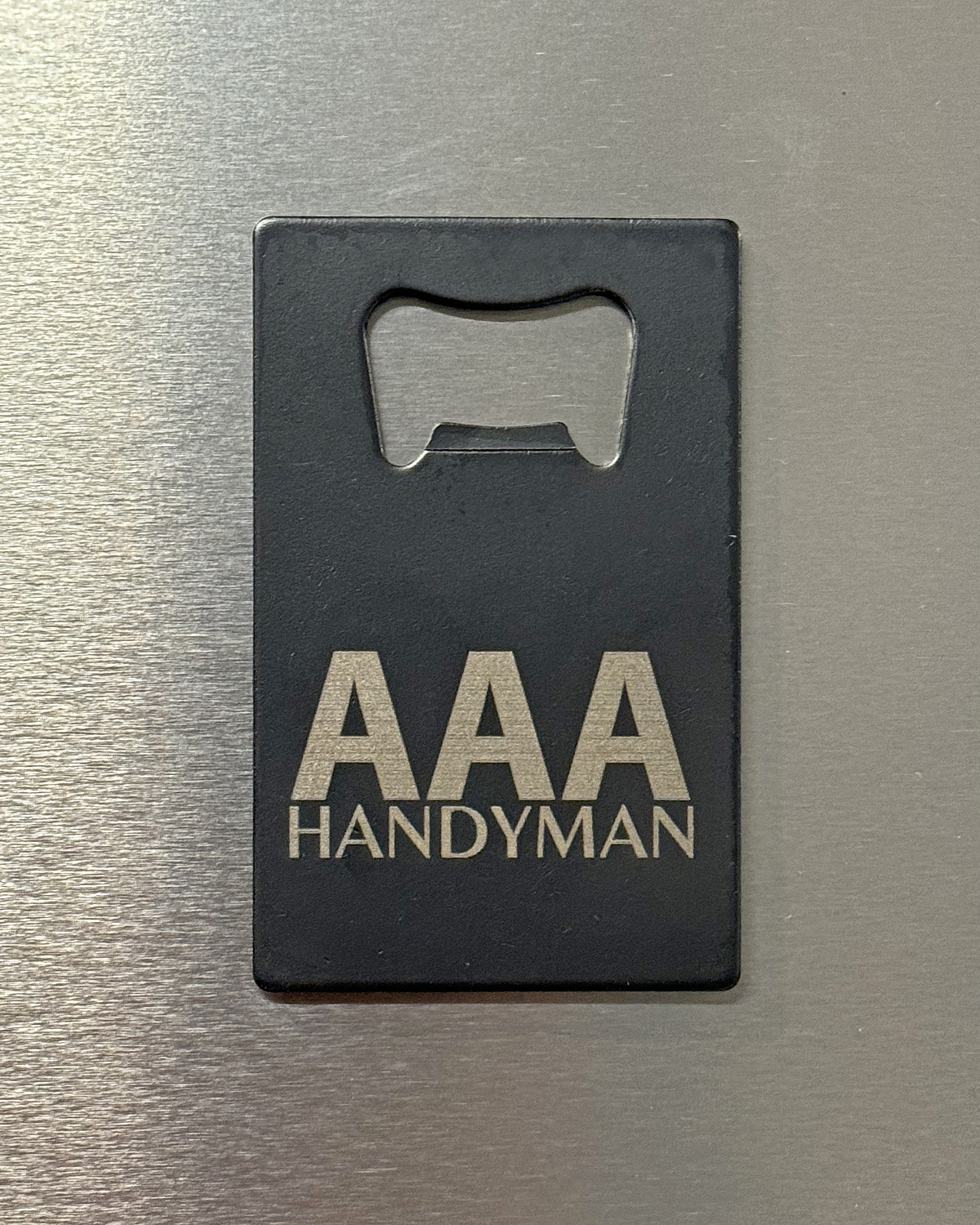 Custom Logo Credit Card Bottle Opener | IMG_1504-AAA_bottle_opener_on_fridge.jpg